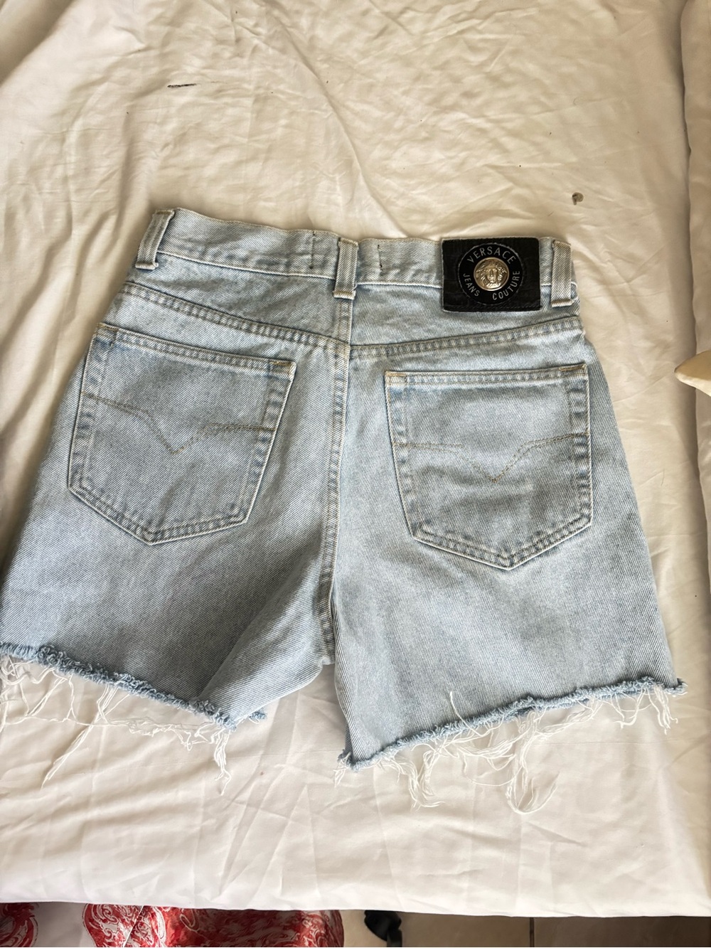 Versace Light Wash Denim Cutoff Shorts with Frayed Hem